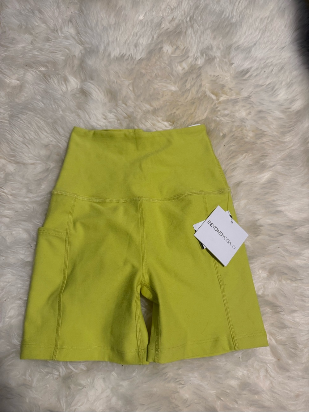 Beyond Yoga High-Waist Lime Green Bike Shorts with Side Pockets